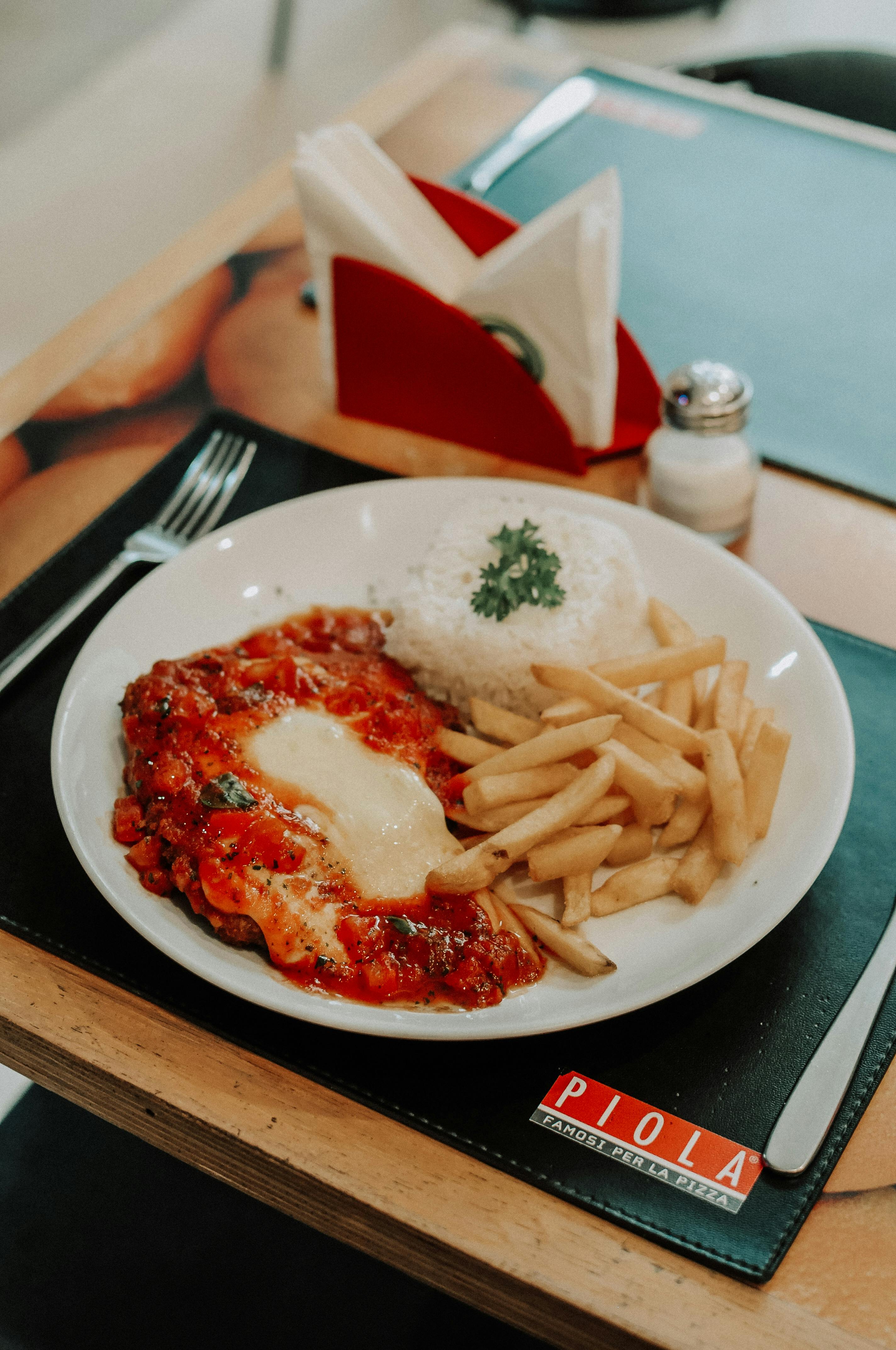 A picture of the finished Chicken Parmesan entrée dish.